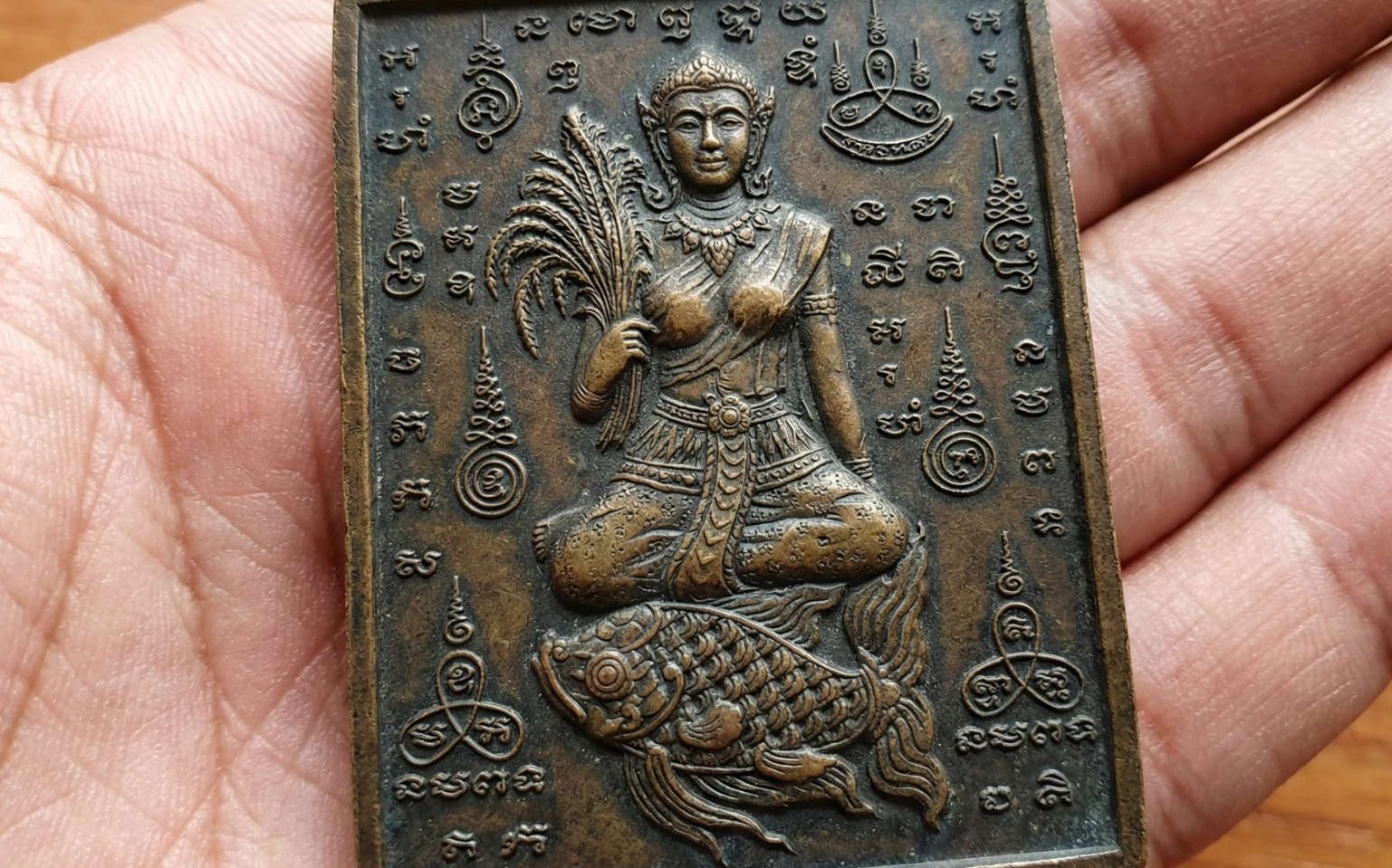 Known as Mae Phosop in Thailand, she is the spirit of rice and sustenance.