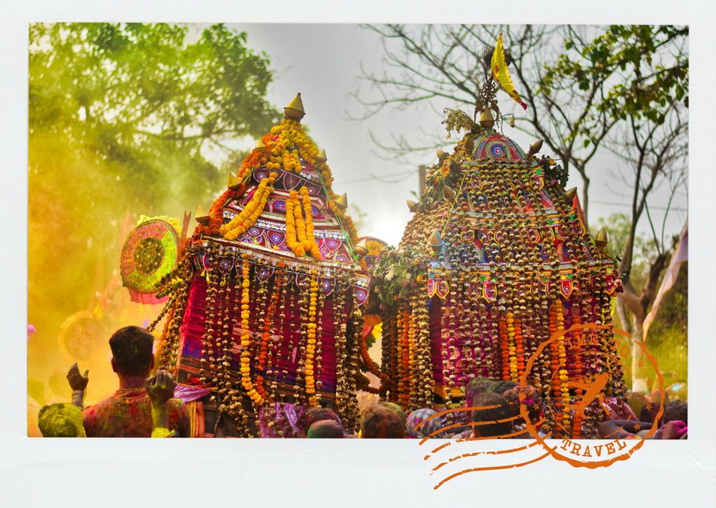 During the famous Rath Yatra in Puri, colossal temple chariots painted in brilliant reds, greens, blues, and yellows roll through the streets amid a sea of pilgrims.
