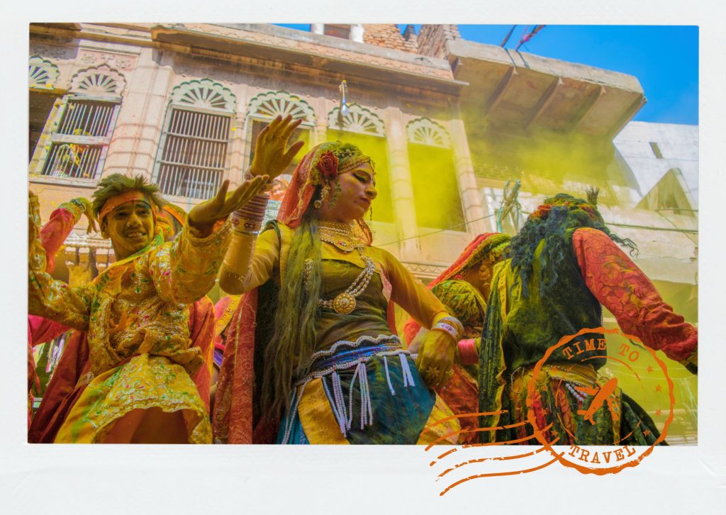 For one day each spring, the ancient city surrenders itself to clouds of pink, orange, green, and violet. Yet beneath the celebration lies something deeper. 