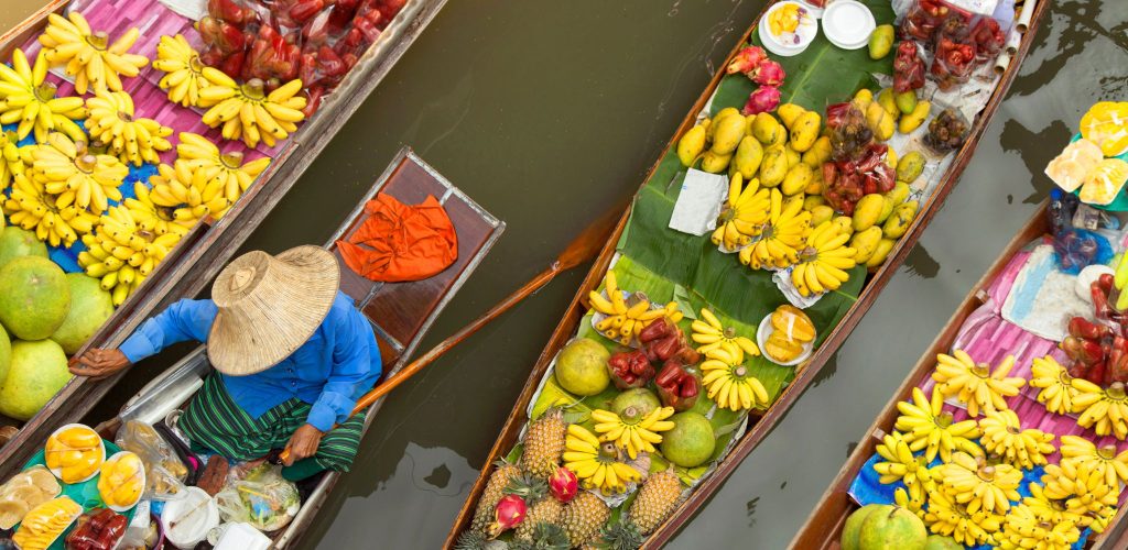 Thailand Floating Market with with merchants selling fruits in the boat