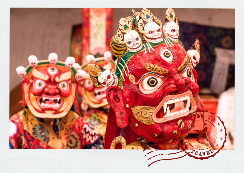 Masked Buddhist monks performing sacred cham dances during the Hemis Festival at Hemis Monastery in Ladakh India
