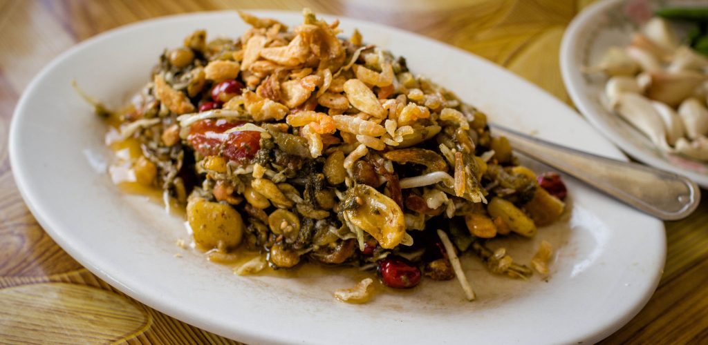 lahpet, fermented tea leaves are transformed into one of the country's most distinctive dishes, fermented tea leaf salad or lahpet thoke, a salad combining tea leaves with nuts, seeds, garlic, and other ingredients.